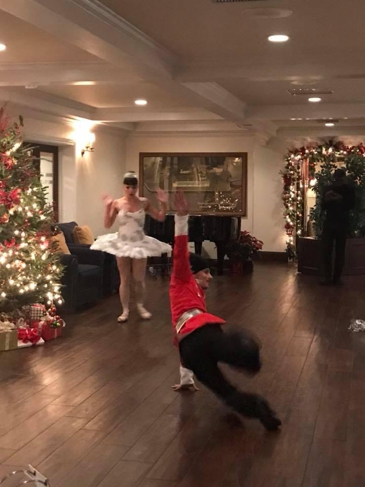 Performers entertain guests at a customer holiday event